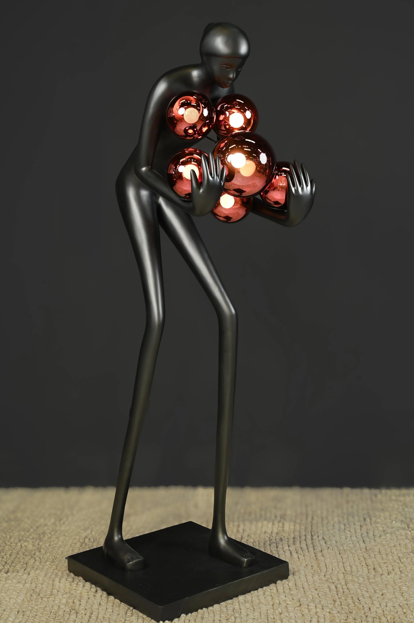 Black Man Holding Red Ball Lamp