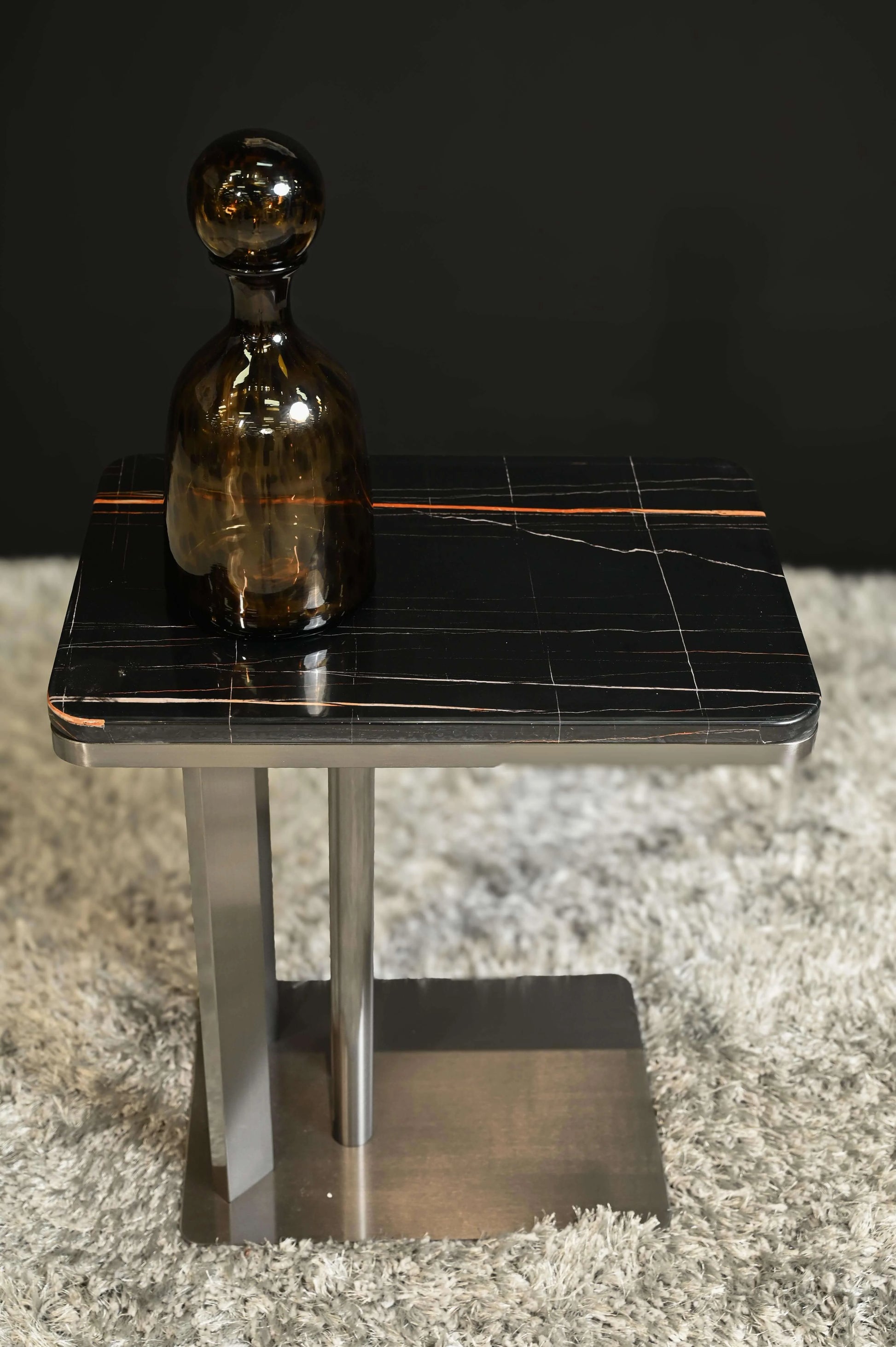 Dean Side Table With Glass Bottle on Top