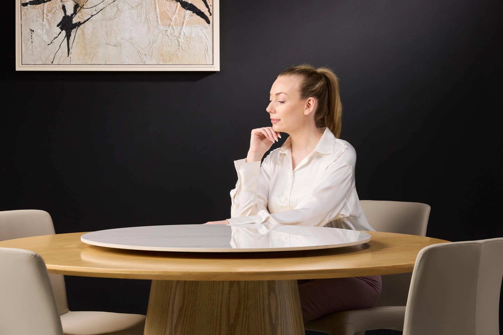 Female Model Posing on Hedda Light Wood Dining Table