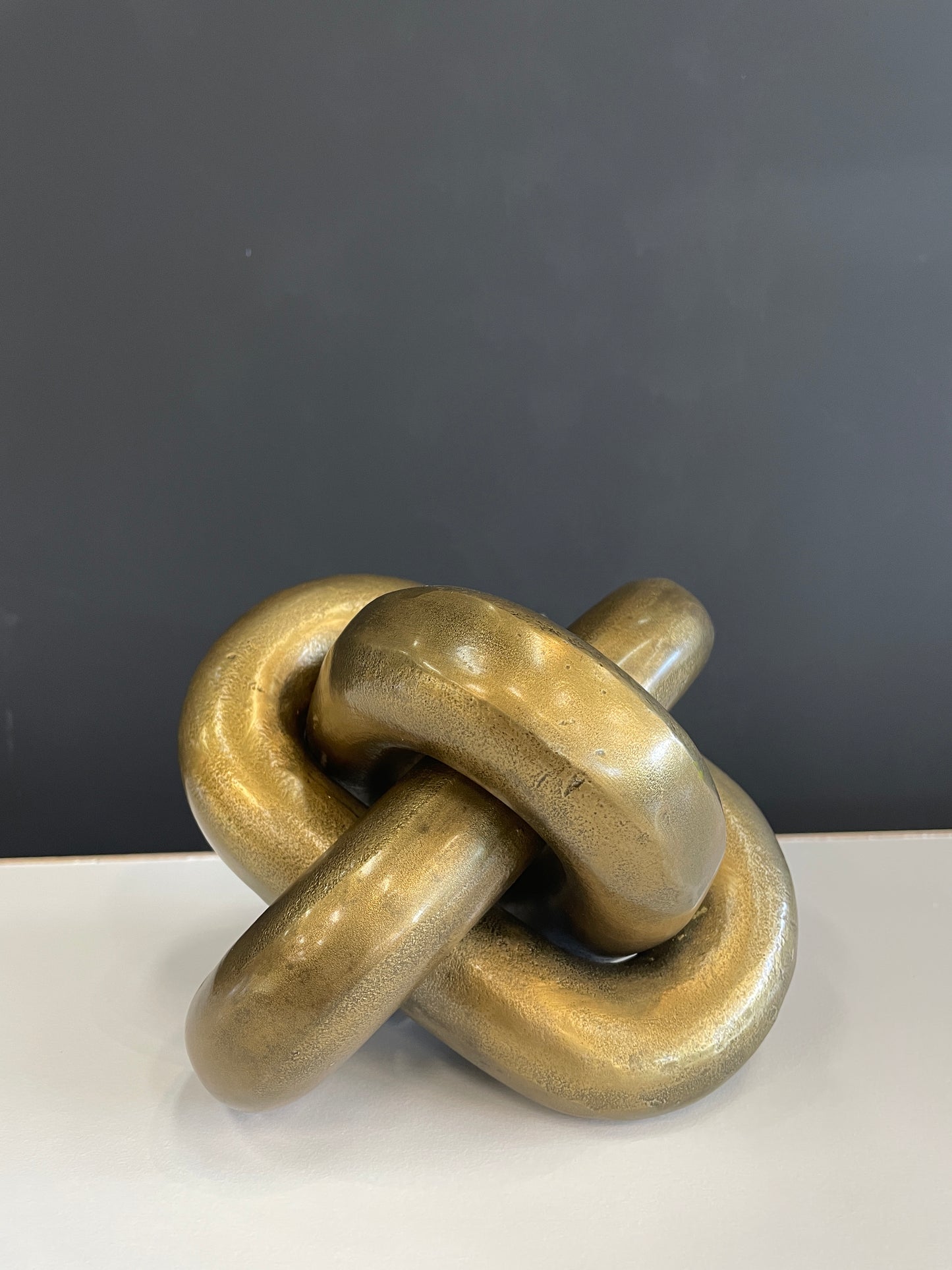 OS12 gold knotted statue