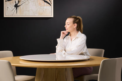 Female Model Posing on Hedda Light Wood Dining Table