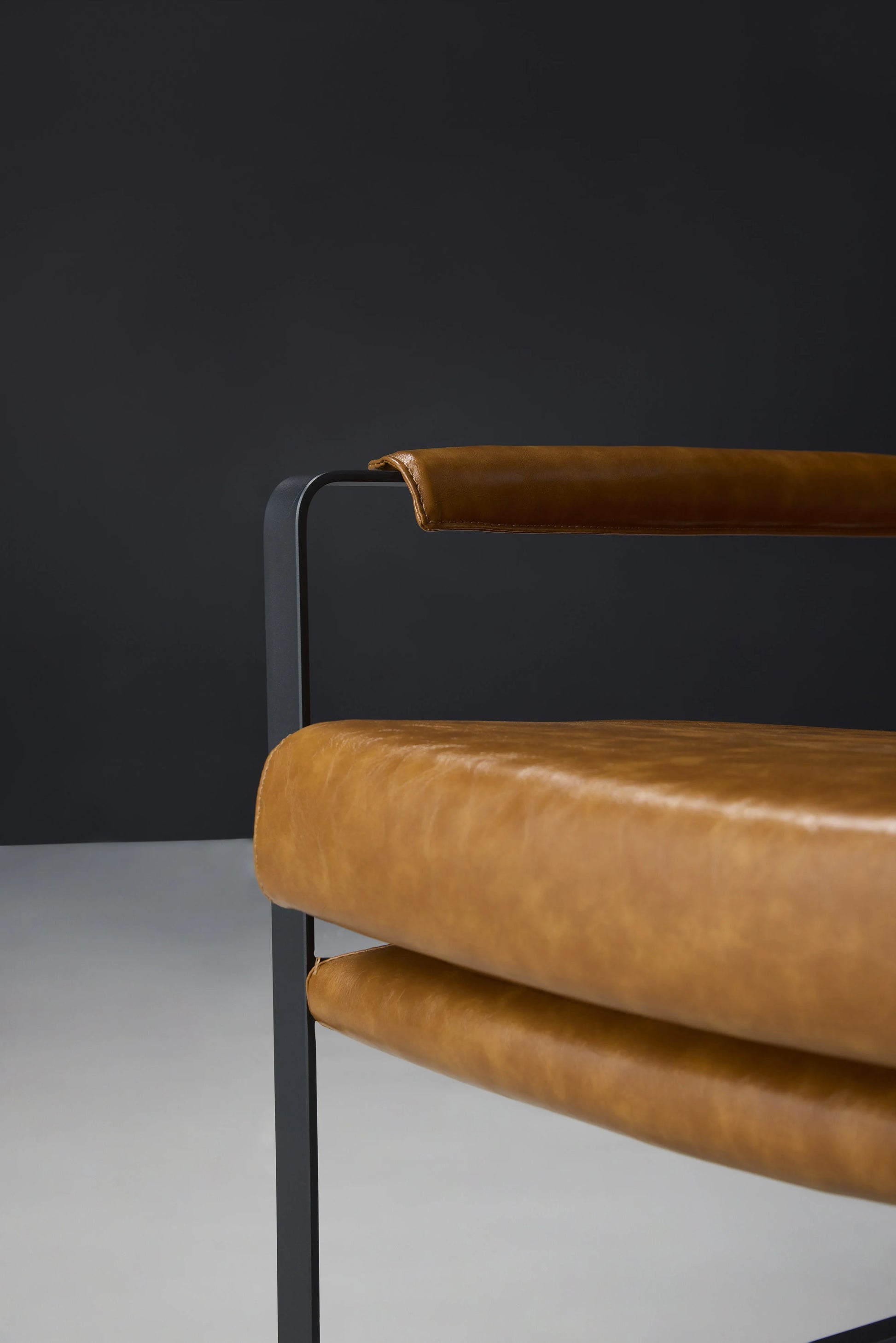 Hazel Brown Leather Chair Iron Frame and Armrest Detail