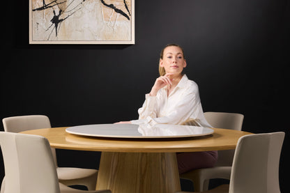 Hedda Light Wood Round Dining Table - Female Model Glance